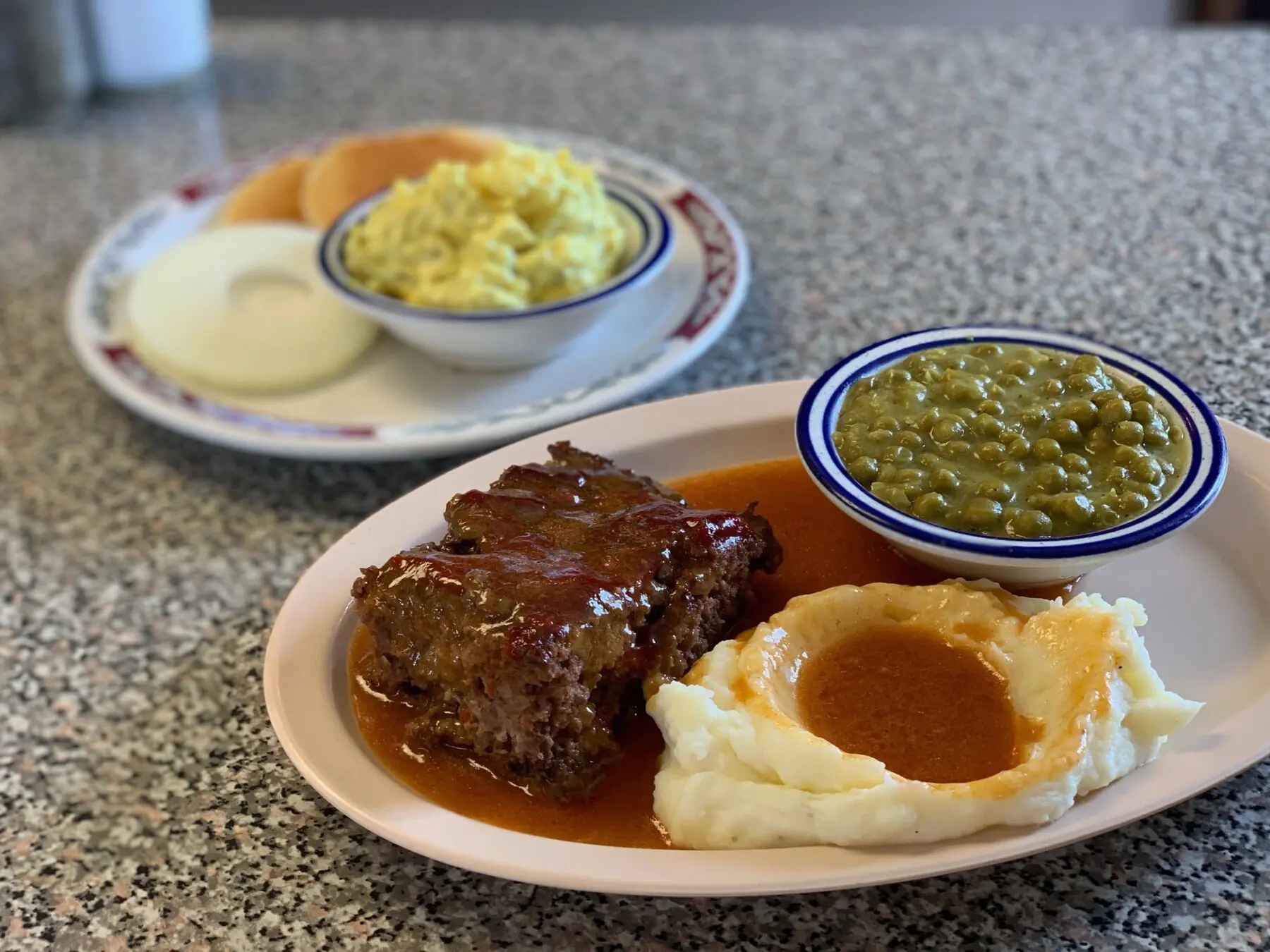 Lunch House meatloaf, mashed potatoes, and peas